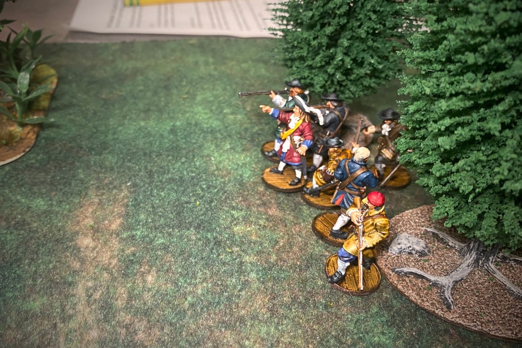 The English take up firing positions in the woods