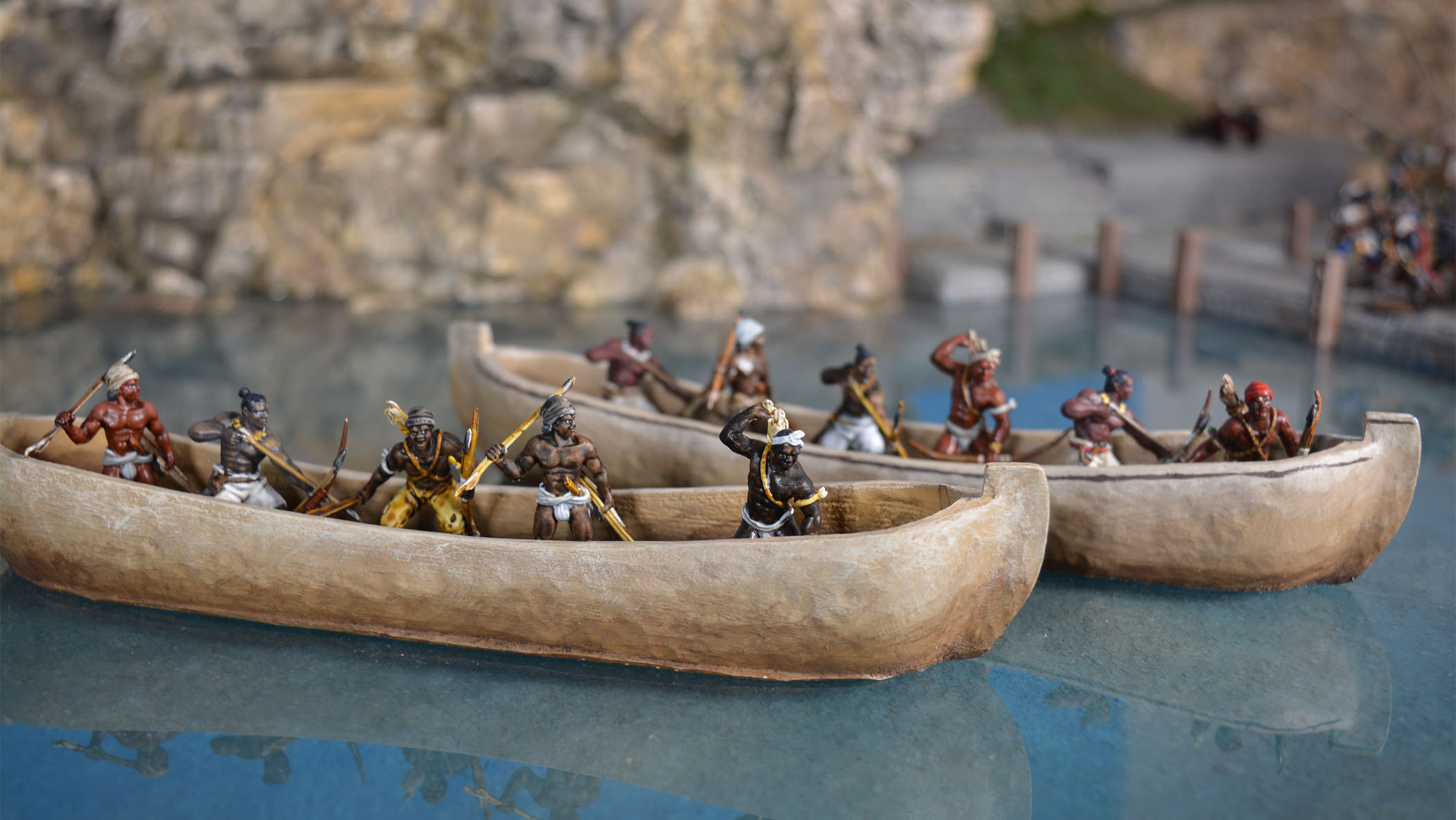 Two 28mm dugout canoes with Blood & Plunder models