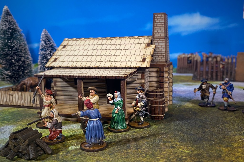 Civilians models in front a wooden cabin