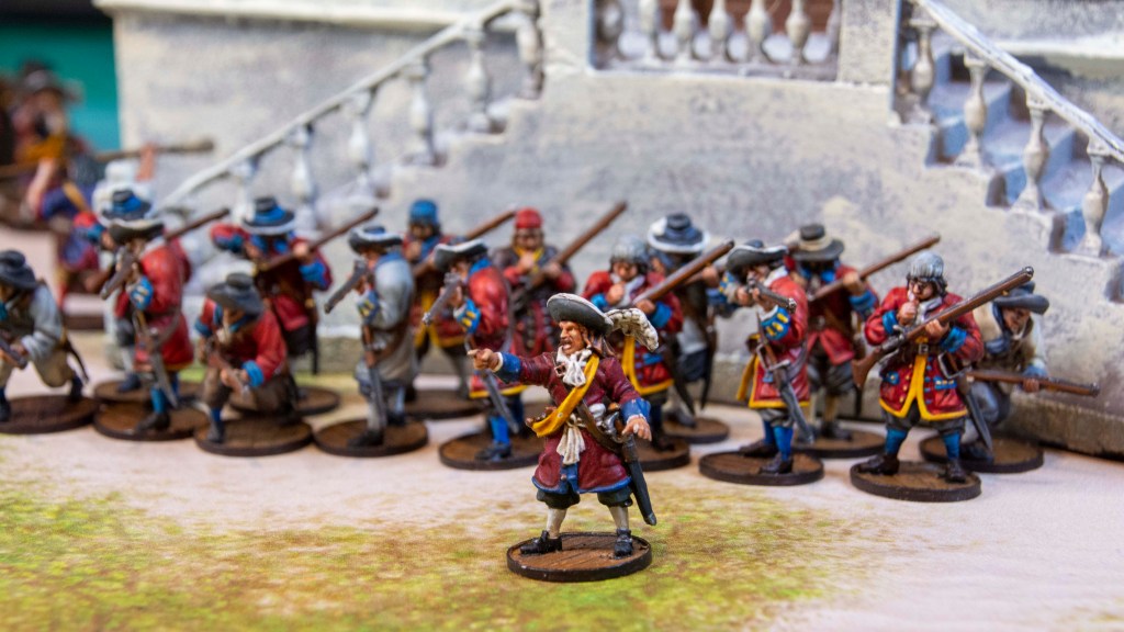 English Blood & Plunder Miniatures in front of the Governor's Mansion from the Miniature Building Authority prepainted wargaming terrain product line
