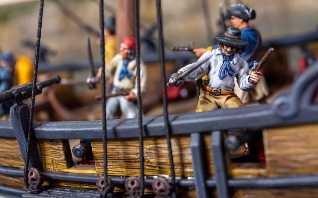 blood and plunder painted pirates on sloop