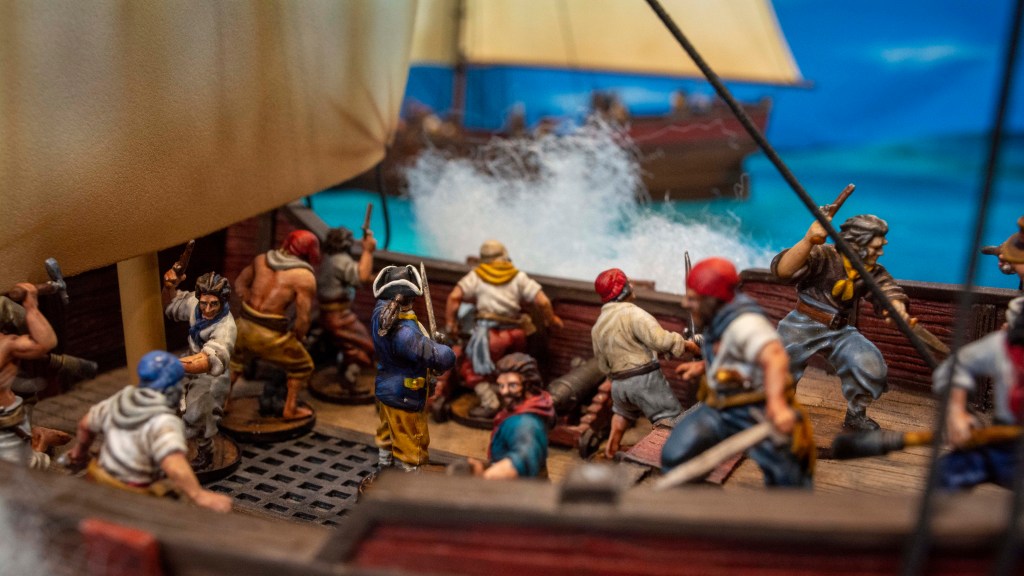 blood and plunder cannons firing on ship