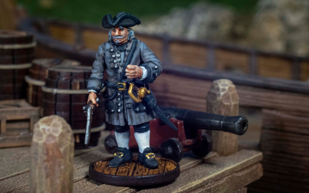 Benjamin Hornigold custom Blood & Plunder miniature on a dock