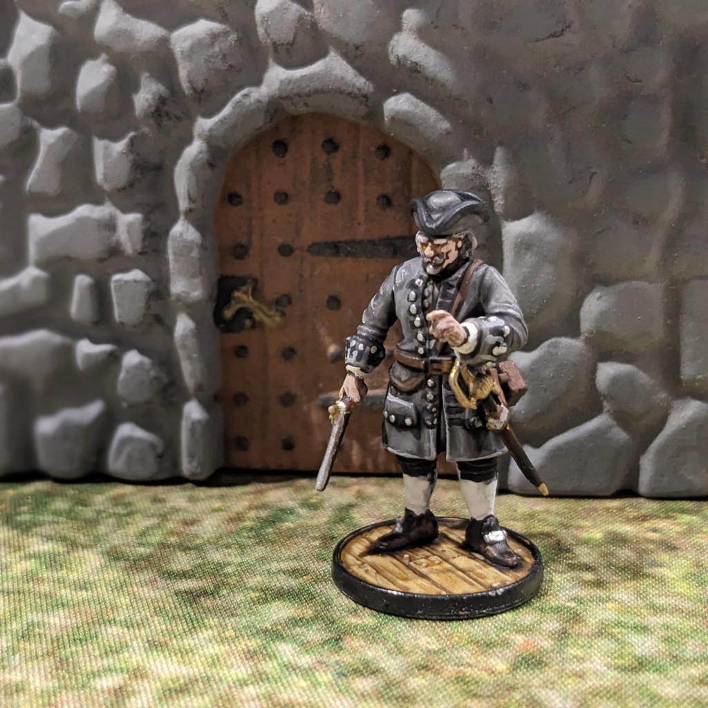 Benjamin Hornigold at the door of a stone fort