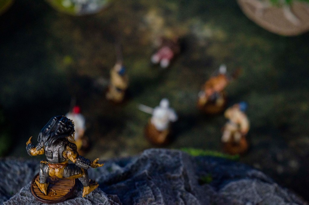A Predator on a cliff stalks its prey below