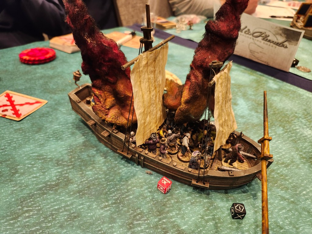 Fernando Artega's Barco Luenga is on fire, but he manages to put out one fire and survive the first round of the game