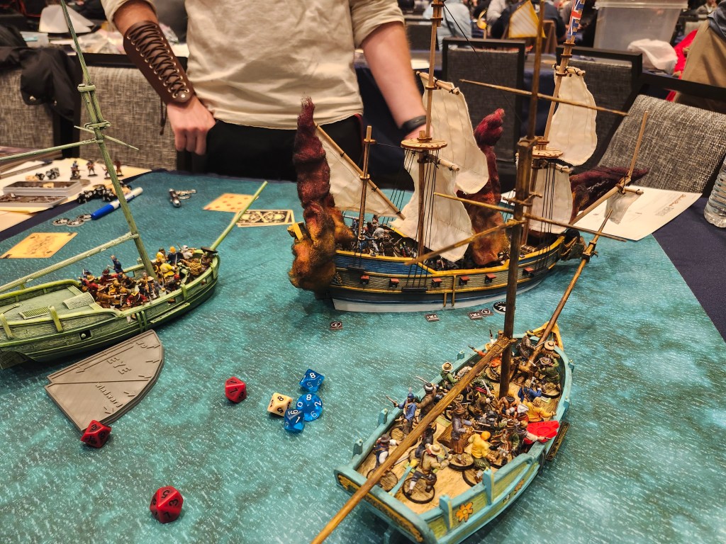 Jason Klotz vs Erich Goebel in the second round of the Blood & Plunder Sea Tournament at AdeptiCon 2024