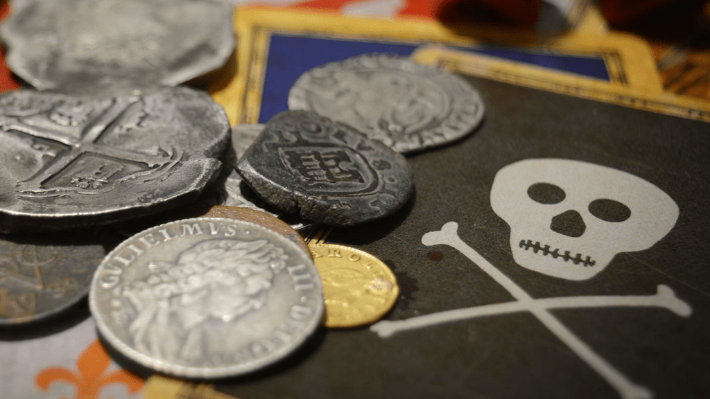 Summer of Plunder 2021 badge image - coins, dice and cards