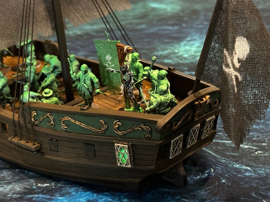 Ghost pirate ship with eerie green LED lights and stylized ghost pirates