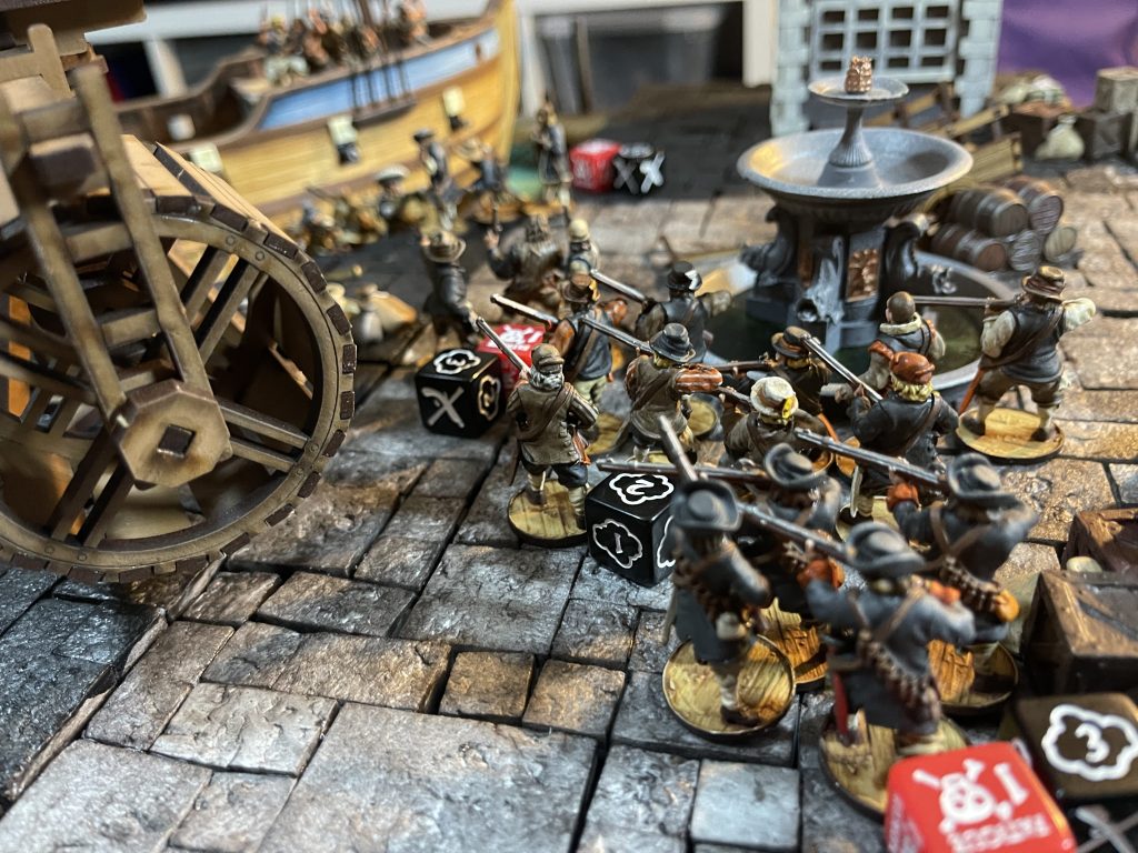 Blood & Plunder models battling at the dockyards