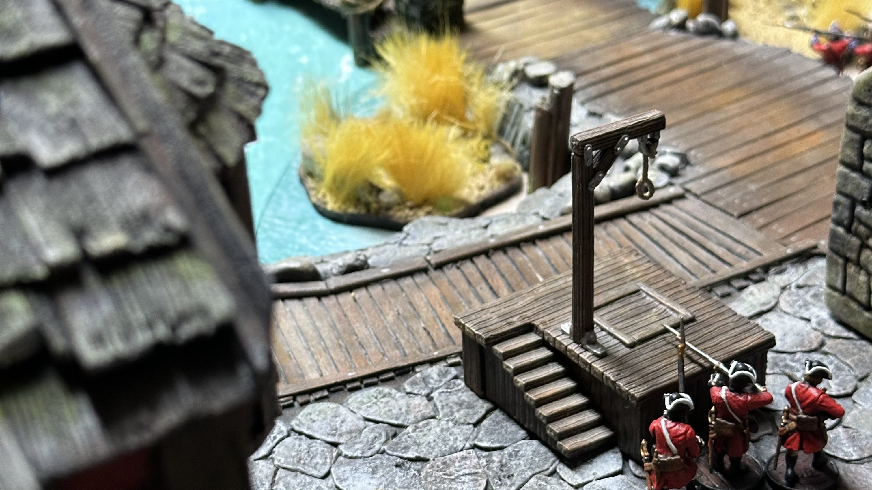 British soldiers near the gallows in a game of Blood & Plunder
