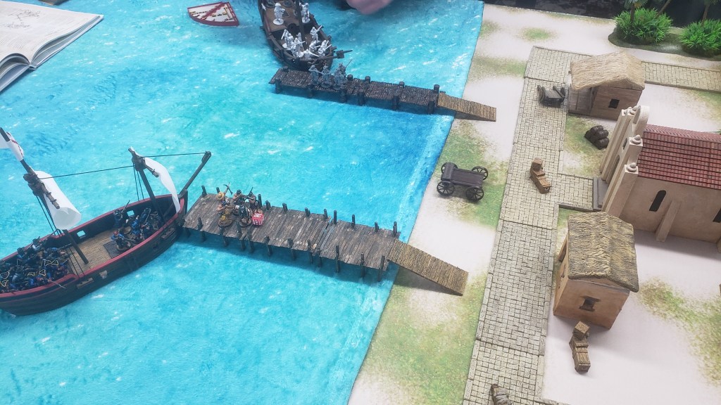 Two blood and plunder boats prepare to dock in an amphibious assault in a game of Blood & Plunder