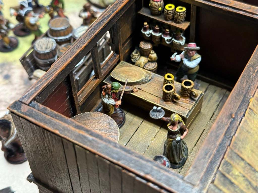 Shopkeeper, pirate and marmaid in a tavern room - photo by Dexter Heide
