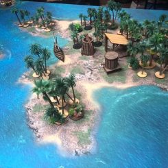palm trees on a wargaming table islands with ships and buildings